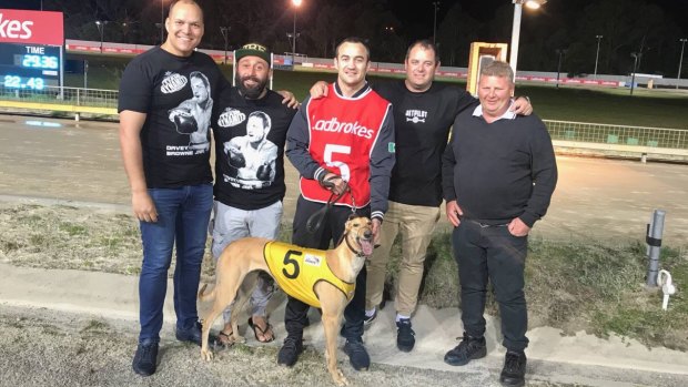 Tribute: Matthew Gibbons, Robert Lewis, Tommy Browne, Glen Smith and John Smart with Dynamite Davey, a greyhound named in honour of Tommy's brother Davey Browne who died after a boxing bout. 