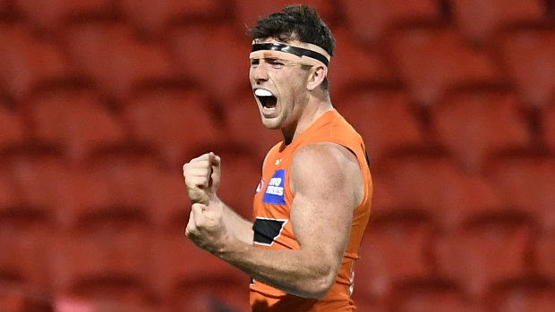 GWS Giant Brent Daniels celebrates a goal against Essendon.