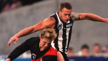 Matthew Banks battles  Saverio Rocca on Anzac Day in 1998. Rocca kicked a bag of goals after Banks went off with an injured shoulder.