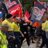 CFMEU workers march through Brisbane streets to protest safety concerns at Cross River Rail  worksites