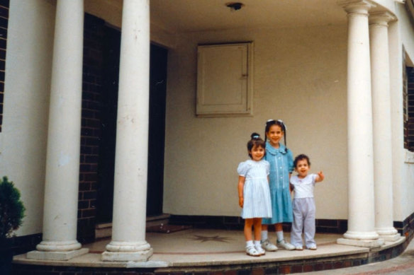 Dassi, Nicole and Elly at their childhood home in the 1990s.