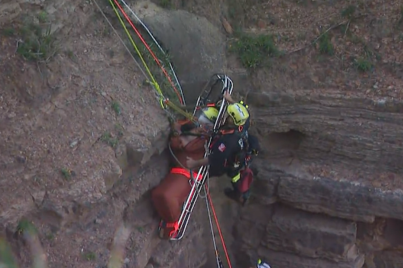 Rescuers faced a tricky moment at an overhang near the clifftop.