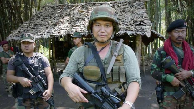 Major General Nerdah Bo Mya in front of one of the huts at Mu Aye Pu.