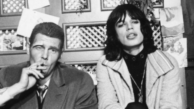 ames Fox (left) as a London gangster, Chas, with Mick Jagger as faded rock superstar, Turner on the set of  Donald Cammell and Nicolas Roeg's psychological thriller, 'Performance'. 