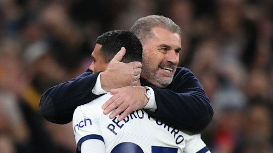 Ange Postecoglou embraces Pedro Porro after Spurs’ third goal.