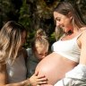 Katrina Gorry and heavily pregnant partner Clara Markstedt with their daughter Harper in May 2024.