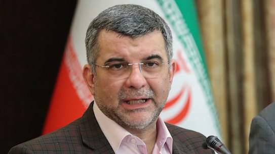 Iraj Harirchi, left, speaks at a press conference on Monday, a day before testing positive for coronavirus.