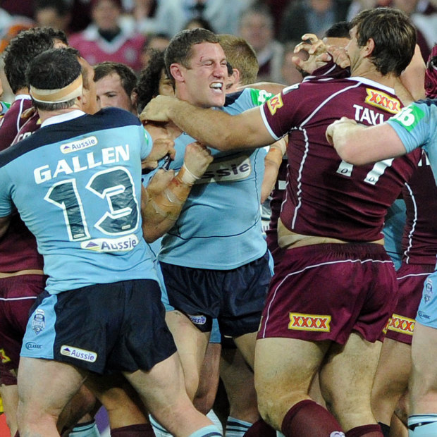 Angry: Luke O'Donnell lashes out at Queensland enforcer Dave Taylor during an Origin clash in 2010.