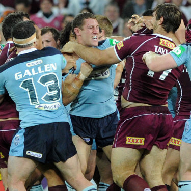 Angry: Luke O'Donnell lashes out at Queensland enforcer Dave Taylor during an Origin clash in 2010.