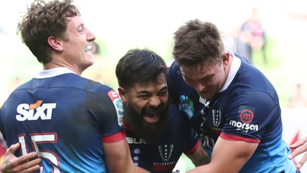 Young Tonumaipea (centre) scores for the Rebels against the Highlanders.