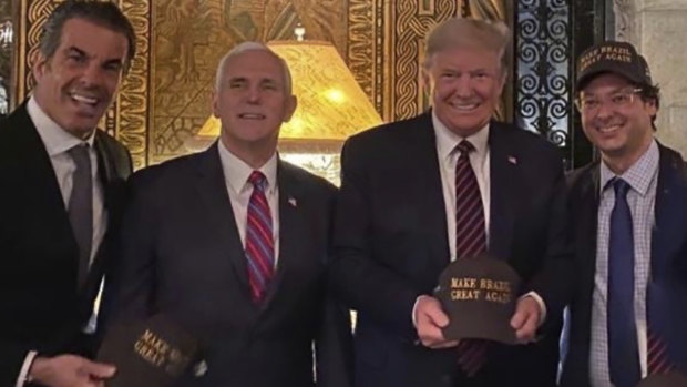 From left, Alvaro Garnero, US Vice-President Mike Pence, President Donald Trump and Fabio Wajngarten, the communications director for Brazilian President Jair Bolsonaro, at Mar-a-Lago in Palm Beach, Florida. 