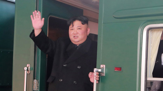 The North Korean dictator Kim Jong-un pictured boarding the train bound for Hanoi from Pyongyang Station in North Korea on Sunday.