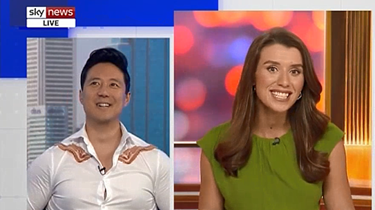 Guest Ryan Williams, wearing rashers of bacon, and Sky News host Freya Leach.