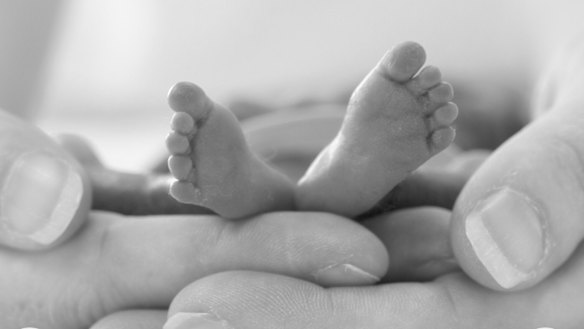 Annabel holding her precious Miles in her hands.