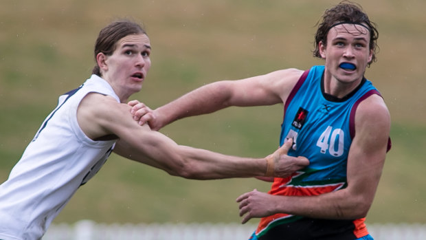 Tall timber: Kieren Briggs, right, in action at the national under-18s championships at Blacktown International Sportspark.