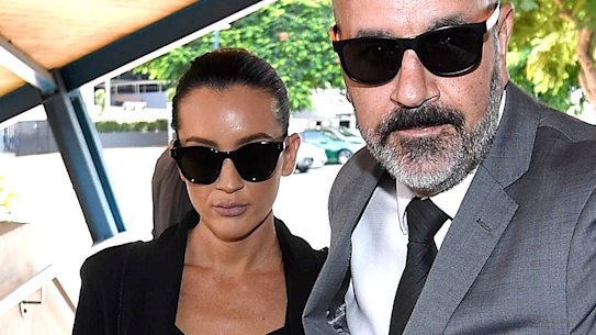 Married At First Sight star Ines Basic arrives with a security guard at the Cleveland Magistrates Court in Brisbane, Tuesday, March 26, 2019. (AAP Image/Dave Hunt) NO ARCHIVING