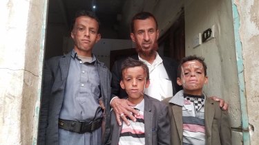 From left, Omar, 12, with his father Mohammed and brothers Ahmed, 10, and Abdul, 9, bear the scars of war. 