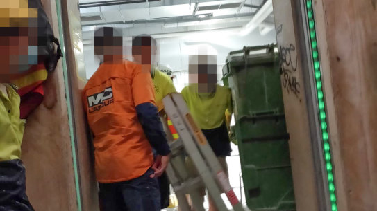 Builders working in close quarters at Multiplex's Collins Arch building site in Collins Street.