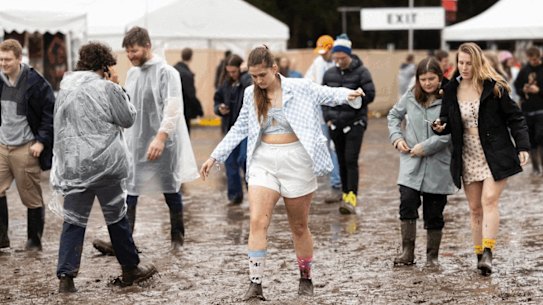 Festival goers battle the mud at Splendour in the Grass on Friday.