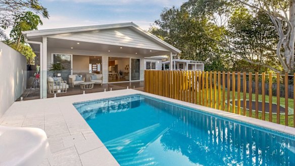 The backyard has a pool, in-ground trampoline and impressive cubby house.