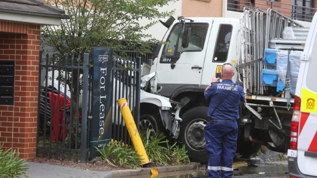 The truck came to rest nose-to-nose with a white SUV, which was badly crumpled and pushed backwards through the steel pole fence.