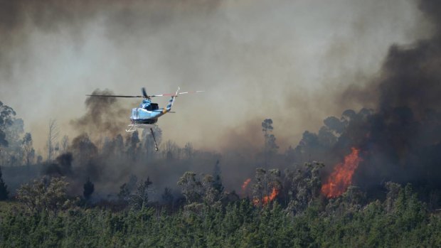 A helicopter works to fight the fire at Mount Clear.