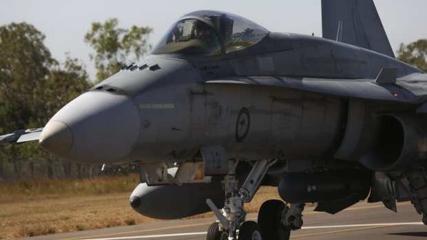 An F/A-18 A/B Hornet fighter jet. Four of the planes will fly over Canberra on Friday.