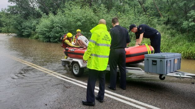 A chemotherapy patient is medically evacuated across the Bohle River near Townsville.