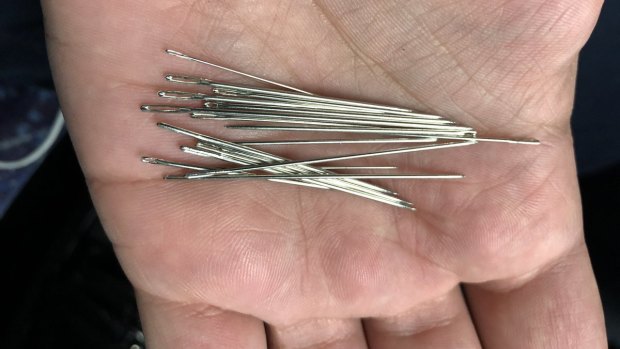 Needles found in a train seat on Tuesday. 