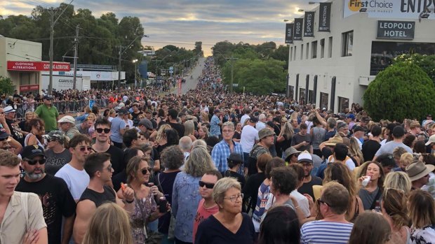 Perth's Canning Highway transformed into a party zone full of mullets, devil horns and AC/DC shirts.