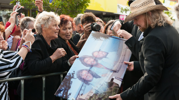Barry Gibb meets fans at the official opening of the second stage of Bee Gees Way in 2015.