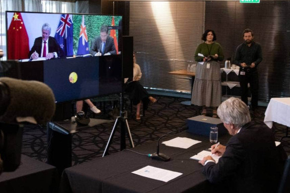 NZ Trade Minister Damien O’Connor and China’s Commerce Minister Wang Wentao sign the upgraded free trade deal via video-link on Tuesday.