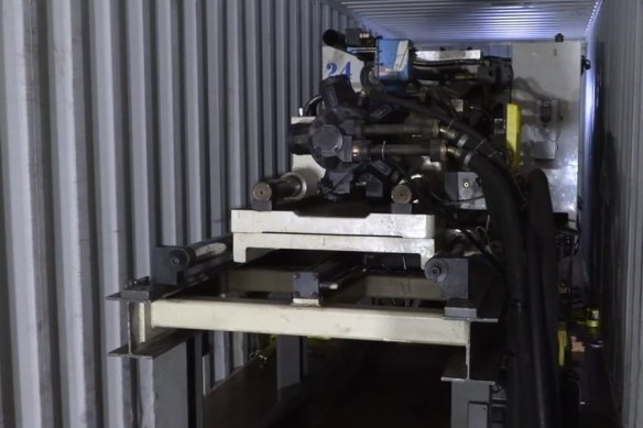 The 'ice' was concealed inside a 15-tonne injection moulding machine, police allege.