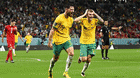 Riley McGree and Harry Souttar of Australia celebrate their 1-0 victory against Denmark.