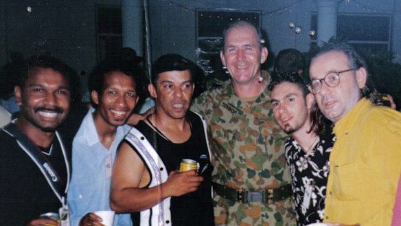 Gil Santos (second from left) and 
Paulie Stewart (yellow shirt) with  fellow Allstars band members and with Peter Cosgrove, commander of the International Force for East Timor