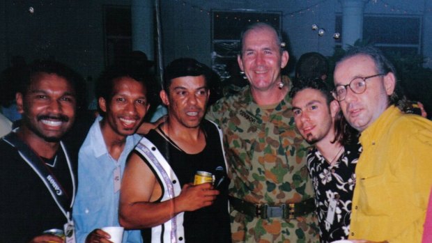 Gil Santos (second from left) and 
Paulie Stewart (yellow shirt) with  fellow Allstars band members and with Peter Cosgrove, commander of the International Force for East Timor