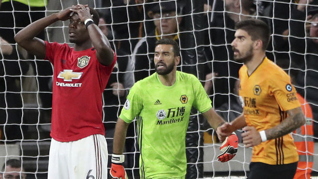 Paul Pogba reacts to his missed penalty, which sparked a torrent of racial abuse online.