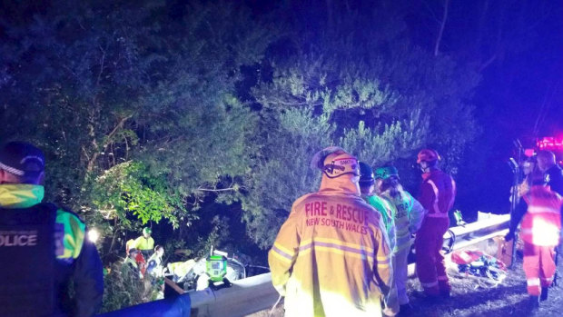 Emergency crews respond to a single-vehicle crash off the Princes Highway, north of Narooma.