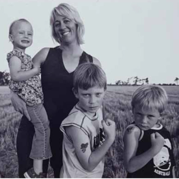 Nedd (right) 2005 with his mum, holding sister Mabel, and brother Logan, centre.