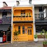The vibrant facade of new Venezuelan restaurant TQM.