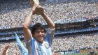 Diego Maradona holds up the trophy after Argentina beat West Germany 3-2 in the World Cup final in 1986.