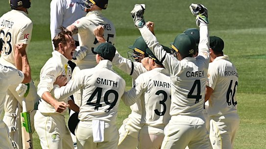 All in this together: Australia celebrate Nathan Lyon’s defeat of Ben Stokes.