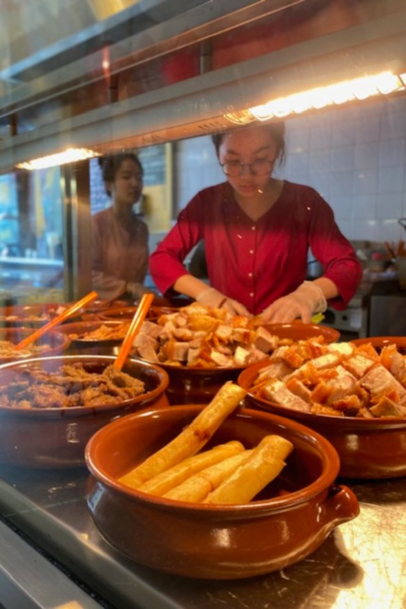 Preparing the banh mi.