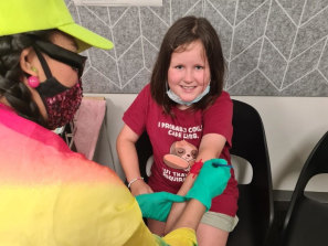 Charlie Murphy, 10, is vaccinated at Chelsea Heights medical centre.