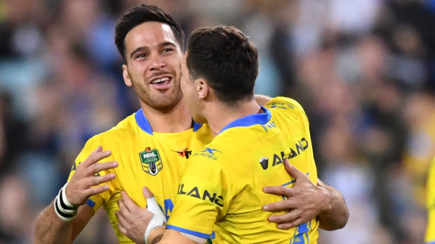 Growing pains: Corey Norman, left, seen here being congratulated by Mitchell Moses, failed to gel with his playmaking partner at the Eels last year after a spectacular start to their double act.