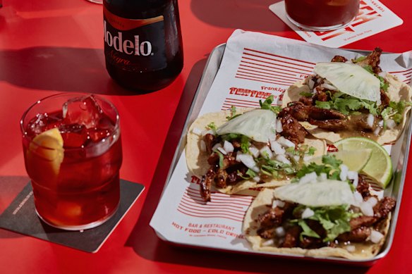 Al pastor tacos with grilled pork, salsa verde and pineapple.