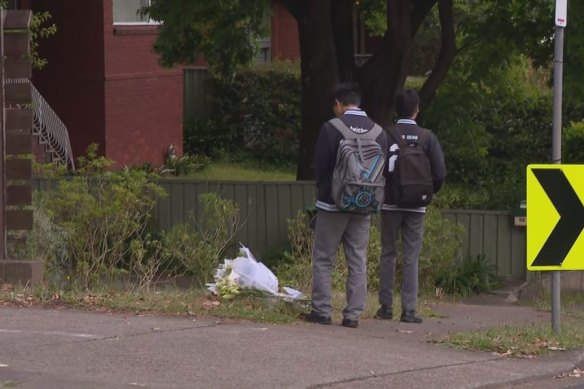 Mourners gathered at the crash site at Rembrandt Street on Friday, laying flowers in tribute.