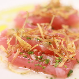 Yellowfin tuna crudo with finger lime dressing.
