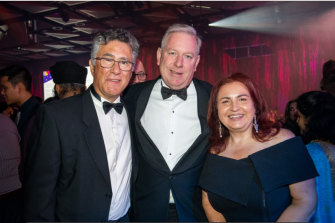 David Davis (center) with guests at the Multicultural Commission gala dinner. 