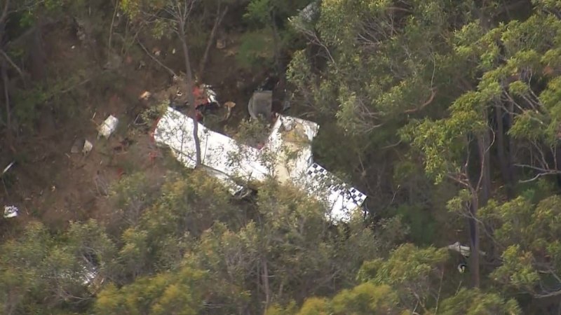 Aerobatic pilot killed after small planes collide mid-air in Sydney